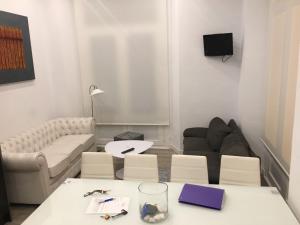 a living room with a couch and a table at Malaga BnB in Málaga