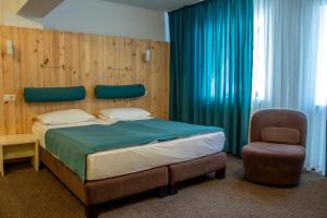 Postel nebo postele na pokoji v ubytování Complex Hotelier COTA O MIE