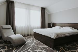 Posteľ alebo postele v izbe v ubytovaní Hotel Nad Nettą