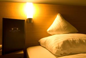 Posteľ alebo postele v izbe v ubytovaní Hotel Bräuwirt