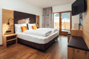 Posteľ alebo postele v izbe v ubytovaní Hotel Edelweiss Superior