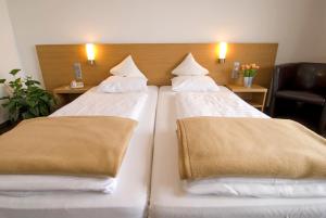 Posteľ alebo postele v izbe v ubytovaní Hotel Bräuwirt