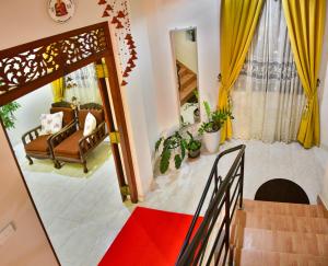 a view of a living room with a red carpet at Villa Hikka 08 in Hikkaduwa