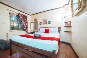 Postel nebo postele na pokoji v ubytování RedDoorz at Tagaytay Road