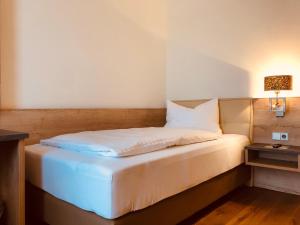 Postel nebo postele na pokoji v ubytování Familie Hopfeld - Hotel Dreikönigshof