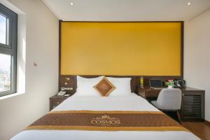 Postelja oz. postelje v sobi nastanitve Cosmos Hotel Danang