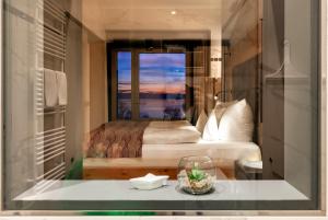 a bedroom with a bed and a window with a view at Rosenhof in Stetten
