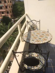 a table and chairs sitting on a balcony at View Talay 1B Residence in Pattaya South