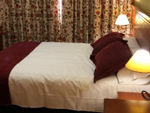 Postel nebo postele na pokoji v ubytování Hotel Camino Real