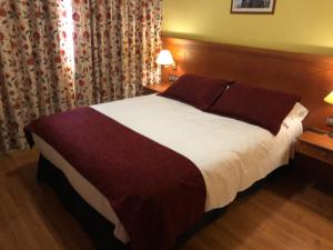 Postel nebo postele na pokoji v ubytování Hotel Camino Real