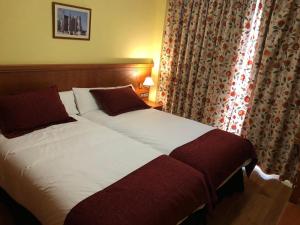 Postel nebo postele na pokoji v ubytování Hotel Camino Real