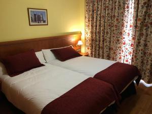 Postel nebo postele na pokoji v ubytování Hotel Camino Real