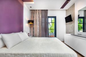 Postel nebo postele na pokoji v ubytování Atrium Hotel
