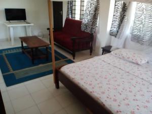Voodi või voodid majutusasutuse Ashari Hotel toas