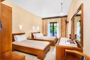 Postel nebo postele na pokoji v ubytování Atrium Hotel