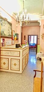 a large room with a counter and a chandelier at Hotel Desirèe in Florence