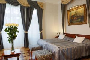 Posteľ alebo postele v izbe v ubytovaní Hotel Vila Livia