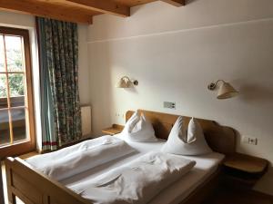 Voodi või voodid majutusasutuse Appartements Rosenstockl toas