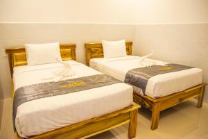 Postel nebo postele na pokoji v ubytování Mui Ne Beach Hotel