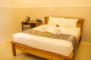 Postel nebo postele na pokoji v ubytování Mui Ne Beach Hotel