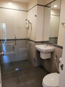 a bathroom with a sink and a shower and a toilet at La La Moon Krabi Poshtel'n' Pool in Krabi