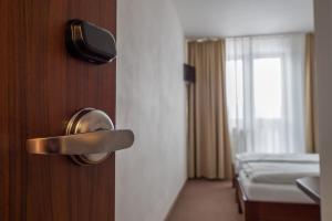 Postel nebo postele na pokoji v ubytování Hotel Polianka