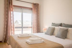 Postel nebo postele na pokoji v ubytování Sea View - Charming Apartment