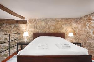 Katil atau katil-katil dalam bilik di Manor House Porto