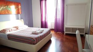 a bedroom with a bed with two stuffed animals on it at Rome Aparts in Rome