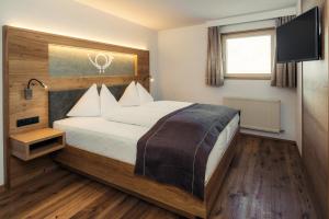 Postel nebo postele na pokoji v ubytování Hotel Post