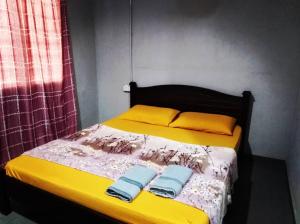 Ένα ή περισσότερα κρεβάτια σε δωμάτιο στο Kampung Guest House +20 φωτογραφίες