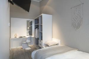 Letto o letti in una camera di CP Resort