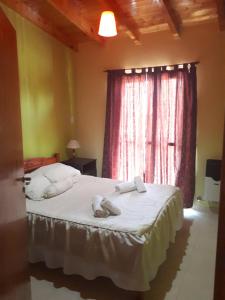 Katil atau katil-katil dalam bilik di Departamentos San Expedito
