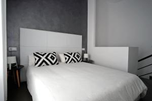 Säng eller sängar i ett rum på Piso Centro de Castellón