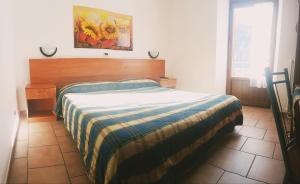 Ein Bett oder Betten in einem Zimmer der Unterkunft Hotel Miramonti