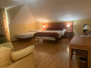 Postel nebo postele na pokoji v ubytování Hotel Camino Real