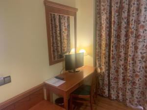 TV a/nebo společenská místnost v ubytování Hotel Camino Real