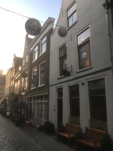 a row of windows on the side of a building at ExLibris Boutique Hotel in Leiden