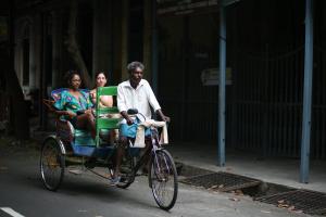 a man and two women riding a rickshaw at Maison Perumal Pondicherry - A CGH Earth Experience in Pondicherry +99 photos