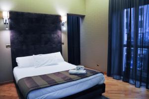Postel nebo postele na pokoji v ubytování Hotel Regina Margherita