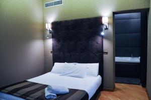 Postel nebo postele na pokoji v ubytování Hotel Regina Margherita