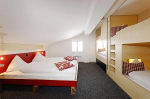 Postel nebo postele na pokoji v ubytování Alpinhotel Bort