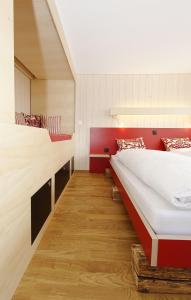 Postel nebo postele na pokoji v ubytování Alpinhotel Bort