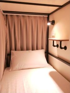 Postel nebo postele na pokoji v ubytování Fuaowo Backpackers Homestay
