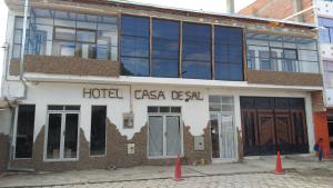 a building with a sign on the side of it at Casa de Sal - Salt Hotel in Uyuni