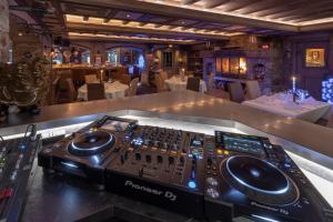 a recording studio with a mixing console in a restaurant at Hotel La Chaudanne in Méribel