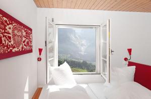 Postel nebo postele na pokoji v ubytování Alpinhotel Bort