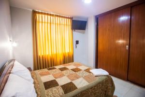 Postel nebo postele na pokoji v ubytování Hostal Vasco