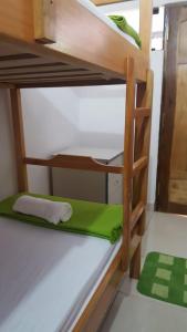 Postel nebo postele na pokoji v ubytování Helecho's Hostal