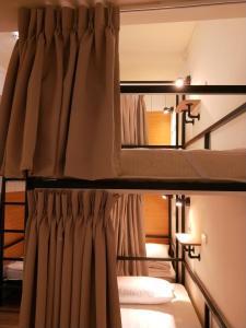 Postel nebo postele na pokoji v ubytování Fuaowo Backpackers Homestay